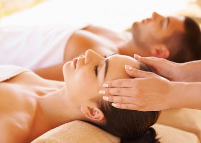 Young couple enjoying a massage seaside